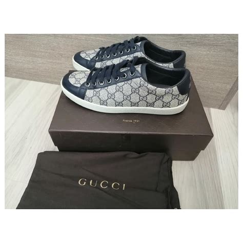 navy blue gucci sneakers.